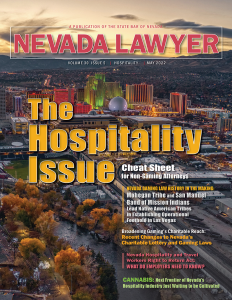 Magazine cover for Nevada Lawyer magazine stating the headline "The Hospitality Issue" with an image of Reno casinos in the background at sunset.
